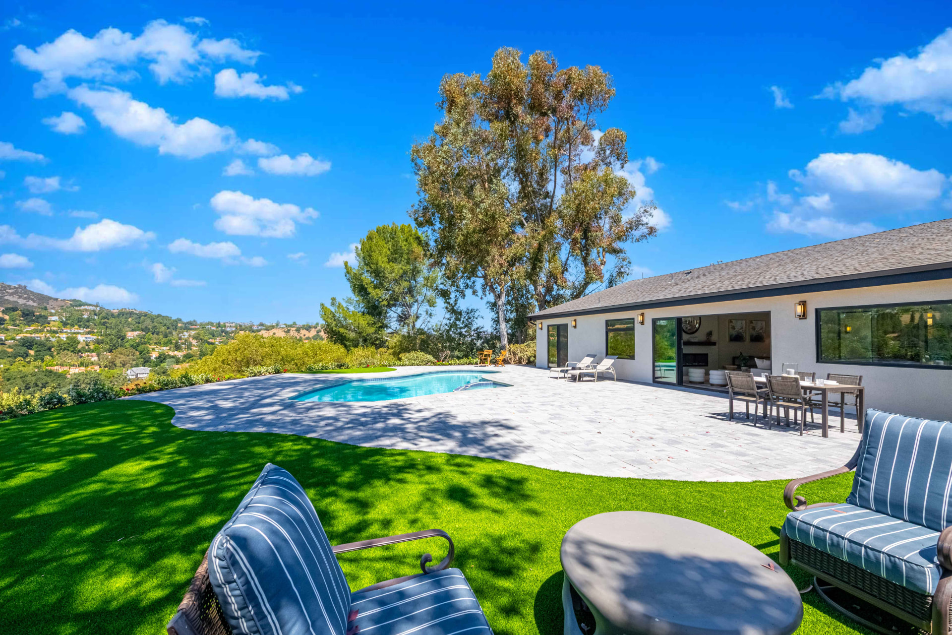 Backyard patio and pool with mountain views — Towhee Drive project